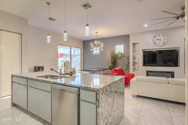 kitchen featuring open floor plan, visible vents, dishwasher, and a sink