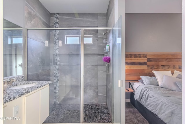 full bath featuring wooden walls, a stall shower, a wainscoted wall, and vanity