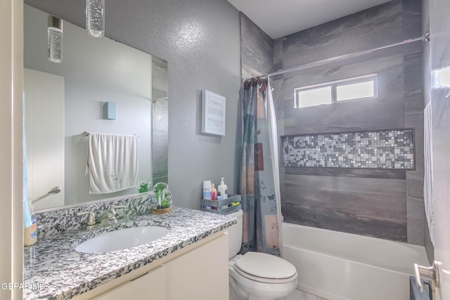 bathroom with shower / bathtub combination with curtain, toilet, and vanity