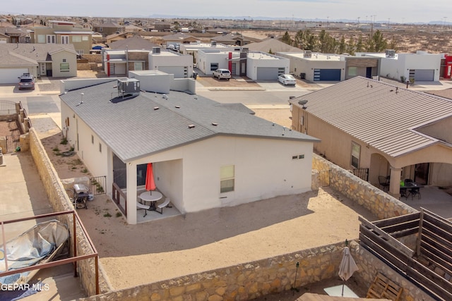 birds eye view of property with a residential view