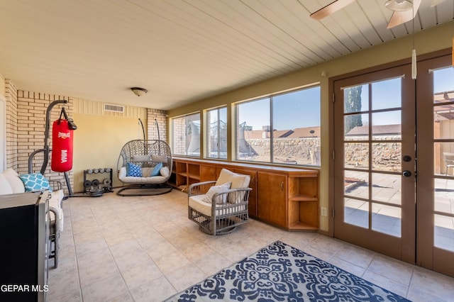 sunroom featuring french doors