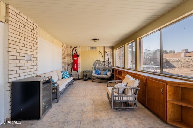 sunroom / solarium featuring visible vents