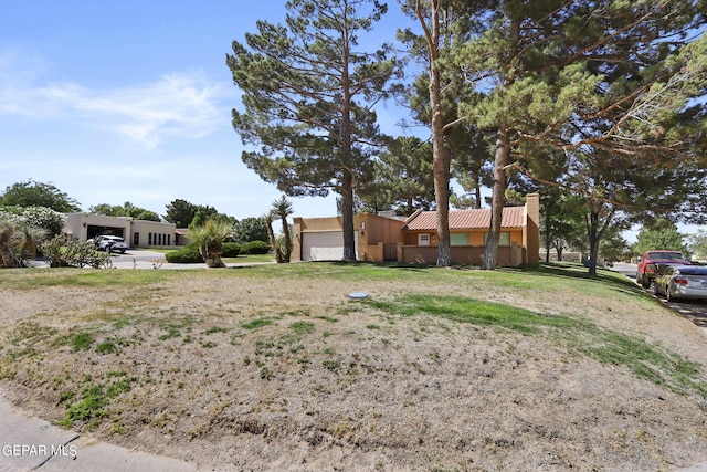 view of yard featuring an attached garage