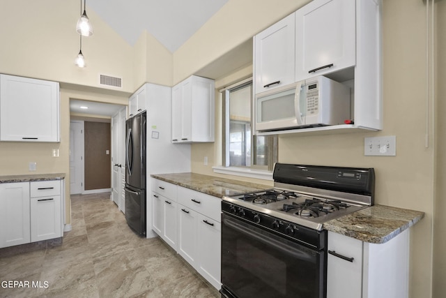 kitchen with visible vents, black appliances, and white cabinetry