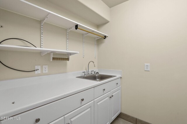 clothes washing area featuring a sink