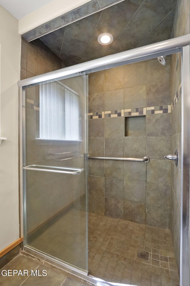 bathroom with a stall shower