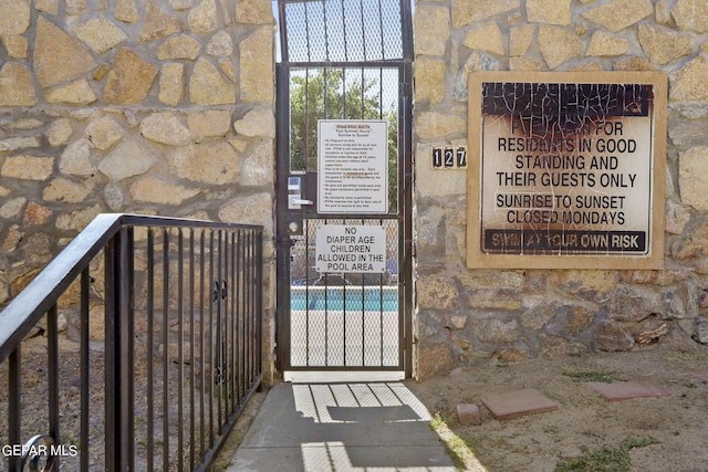 exterior space featuring stone siding