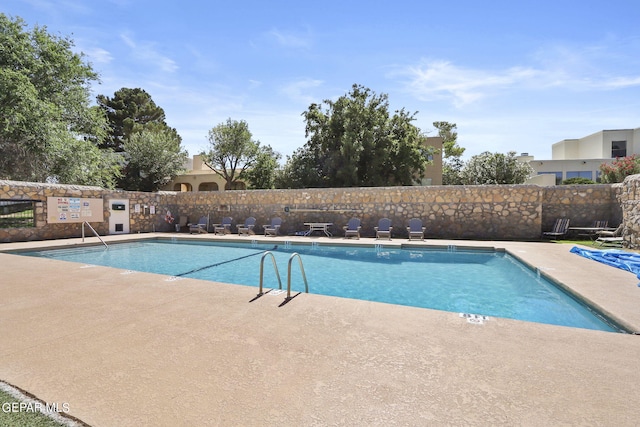 pool featuring fence