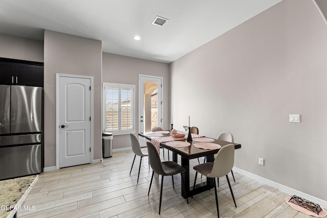 dining space with recessed lighting, visible vents, light wood-style flooring, and baseboards