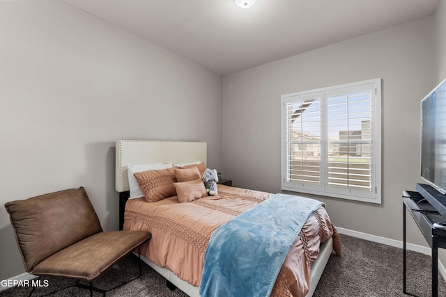 bedroom featuring carpet flooring and baseboards