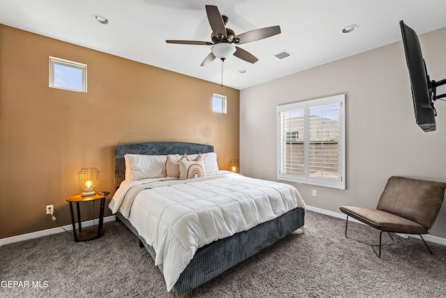 bedroom featuring carpet, multiple windows, and baseboards