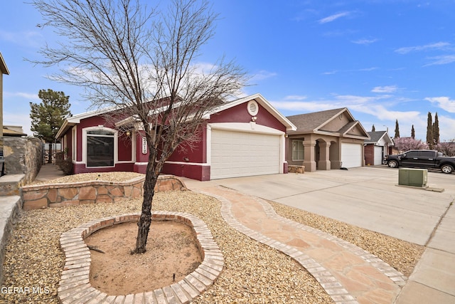 ranch-style house featuring driveway, an attached garage, and stucco siding