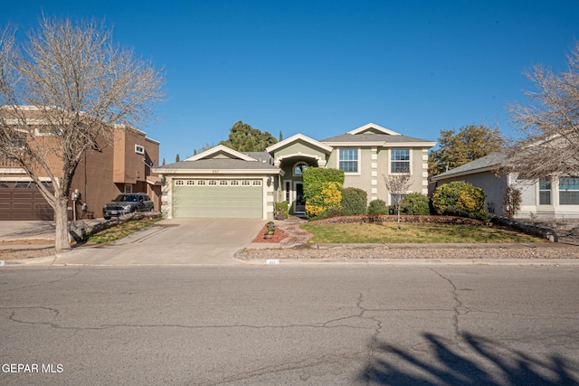 view of front of property with concrete driveway, an attached garage, and stucco siding