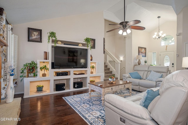 living area with stairs, high vaulted ceiling, wood finished floors, and ceiling fan with notable chandelier