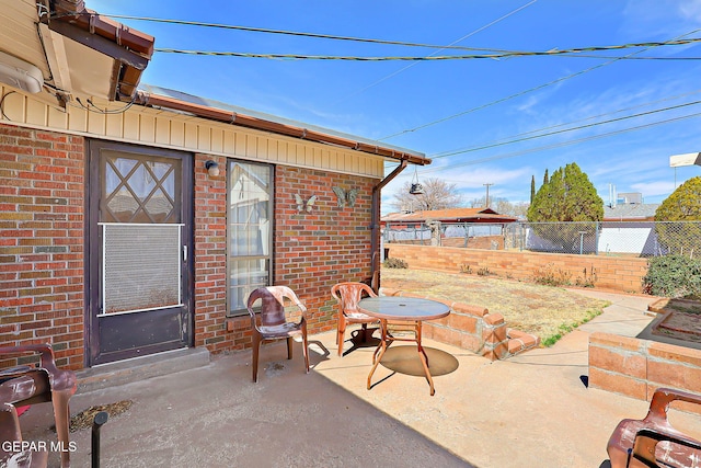 view of patio featuring fence