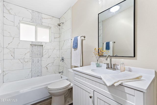 bathroom with vanity, shower / tub combination, and toilet