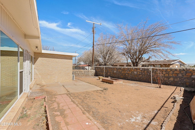 view of yard with a patio and a fenced backyard