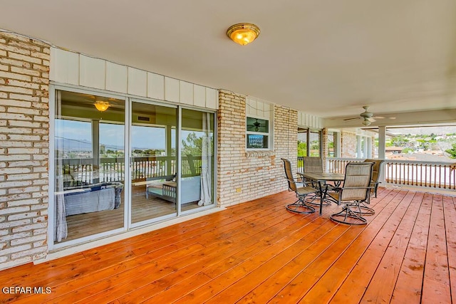 wooden terrace featuring a ceiling fan