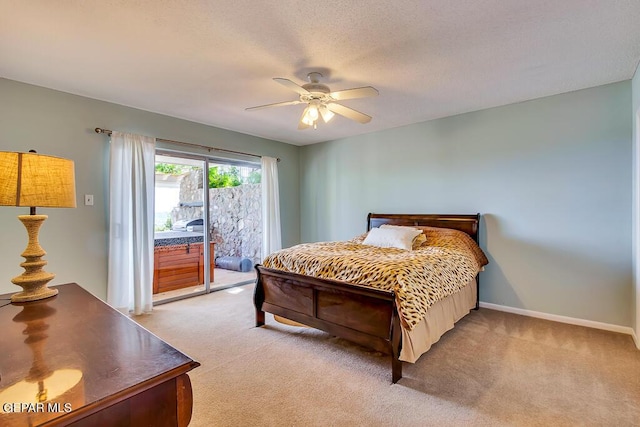 bedroom featuring access to exterior, a ceiling fan, baseboards, and light carpet