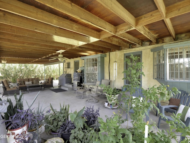 view of patio / terrace featuring a ceiling fan and an outdoor living space