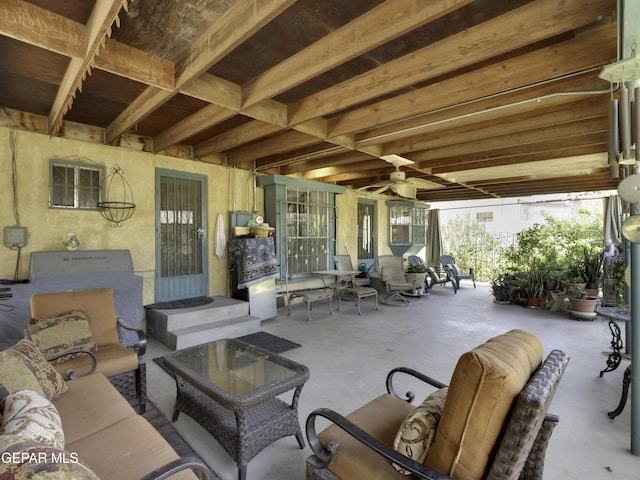 view of patio featuring an outdoor hangout area and a ceiling fan