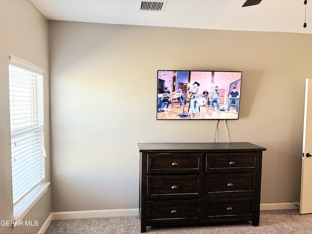 interior details with carpet, visible vents, ceiling fan, and baseboards