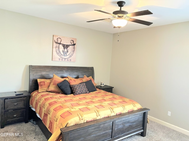 bedroom with light carpet, ceiling fan, and baseboards