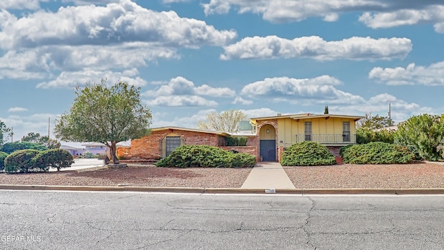 view of front of home featuring brick siding