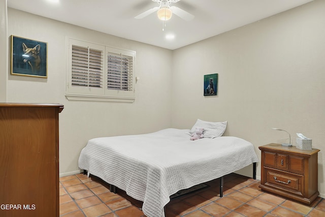 bedroom featuring ceiling fan and baseboards