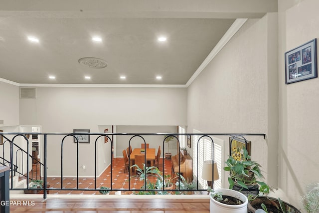 hall featuring ornamental molding, recessed lighting, visible vents, and wood finished floors