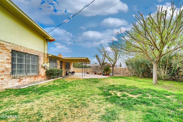 view of yard with a patio and fence