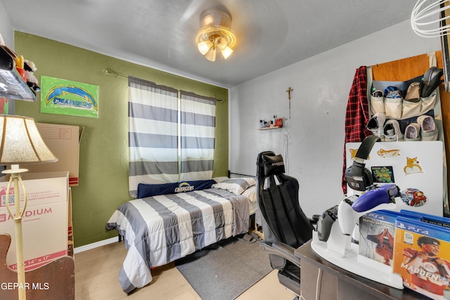 bedroom with wood finished floors