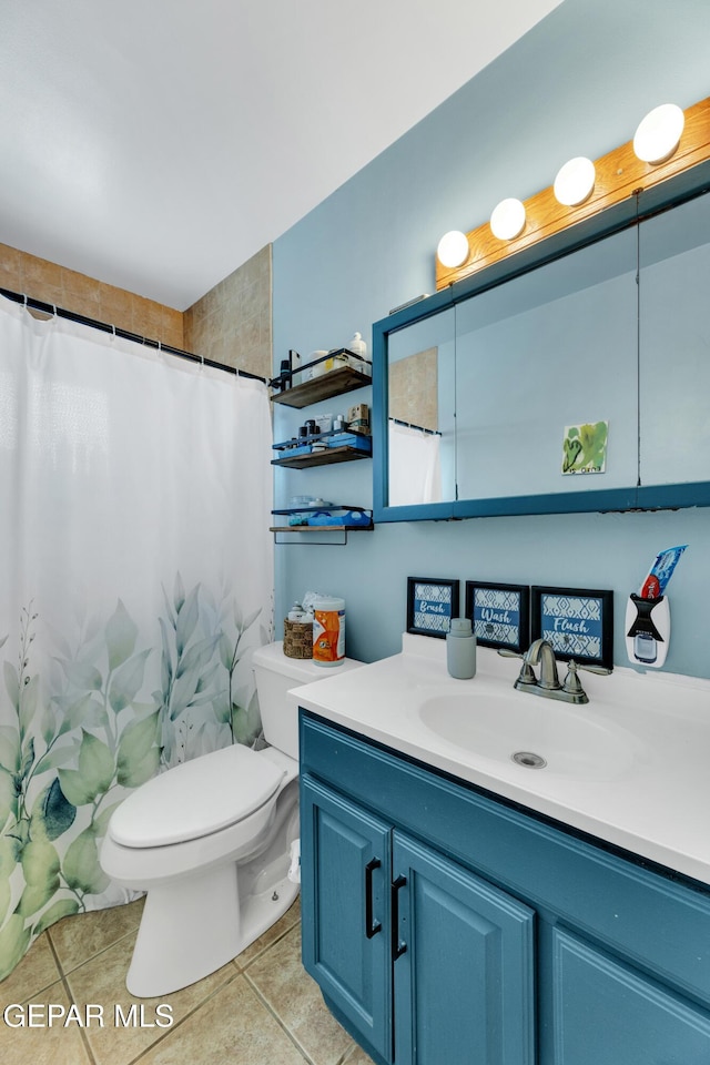 full bath featuring tile patterned flooring, a shower with curtain, vanity, and toilet