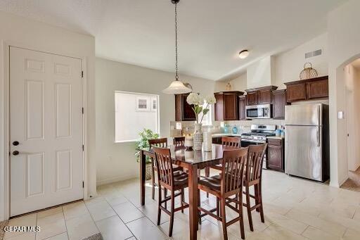 dining room featuring visible vents