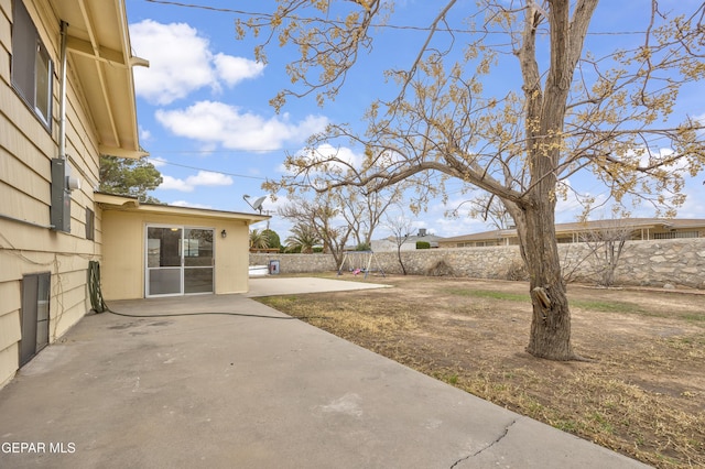 view of yard featuring a patio area and a fenced backyard