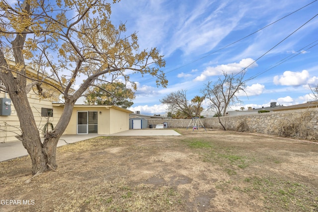 view of yard featuring a patio area and a fenced backyard