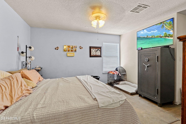 bedroom featuring visible vents and a textured ceiling