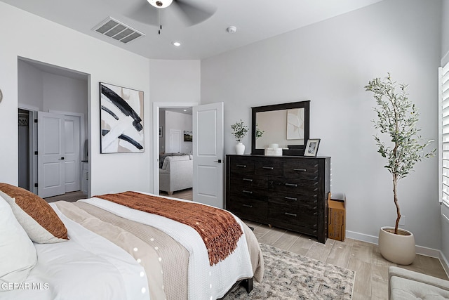 bedroom featuring visible vents, baseboards, light wood-style flooring, ceiling fan, and recessed lighting