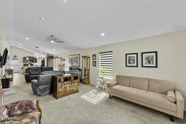 living room with recessed lighting, lofted ceiling, and a healthy amount of sunlight