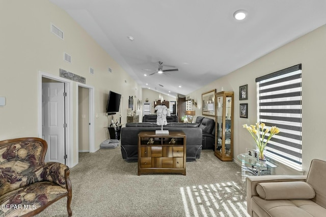 carpeted living area with recessed lighting, visible vents, and lofted ceiling