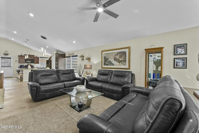 living area featuring recessed lighting, light wood finished floors, a ceiling fan, and vaulted ceiling