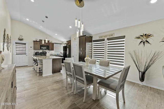 dining room with recessed lighting, baseboards, and high vaulted ceiling