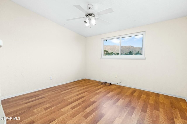 unfurnished room featuring light wood finished floors and ceiling fan