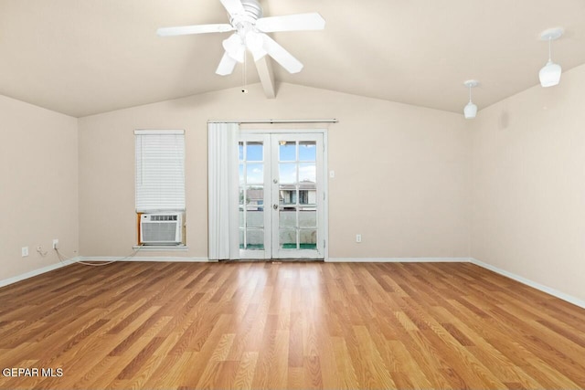 empty room featuring lofted ceiling with beams, light wood-style flooring, baseboards, and cooling unit