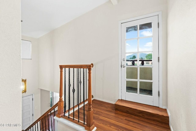 entryway featuring wood finished floors and baseboards