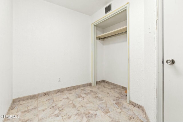 unfurnished bedroom with visible vents and baseboards