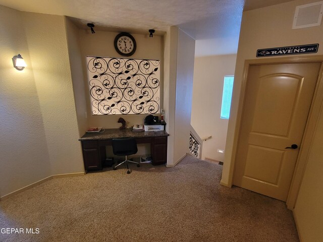 carpeted office with visible vents