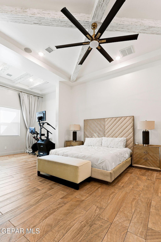 bedroom with light wood finished floors, visible vents, and ceiling fan