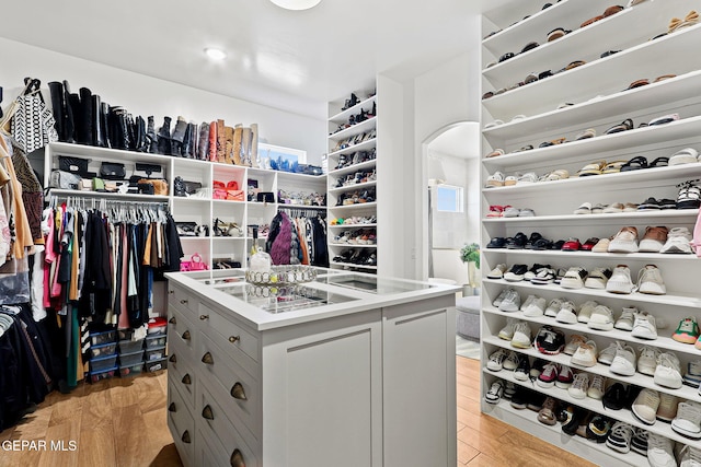 walk in closet featuring light wood-style floors