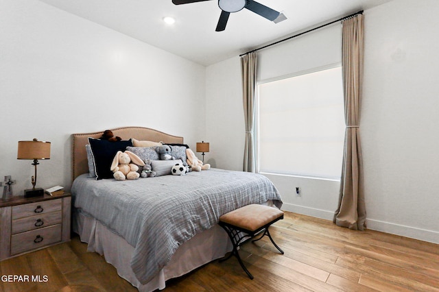 bedroom featuring recessed lighting, baseboards, light wood-type flooring, and ceiling fan